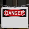 A warning sign displaying the word DANGER in bold red letters
