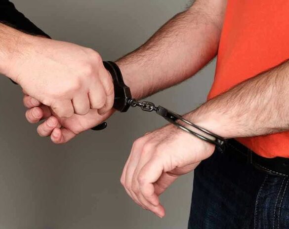 Person handcuffing another persons wrists