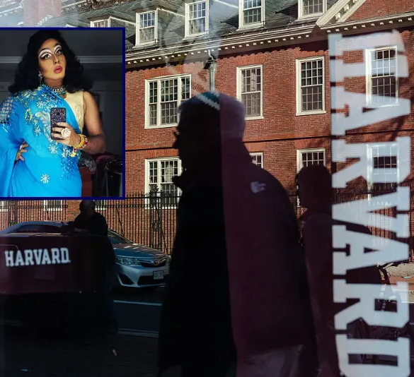Harvard University is reflected in the window of a merchandise store across the street from the school on April 17, 2025 in Cambridge, Massachusetts. The Trump administration announced that it would block Harvard University from receiving $2.2 billion in federal grants and $60 million in contracts after the school refused demands to adopt new policies relating to student and faculty conduct, admissions, anti-semitism on campus and DEI. (Photo by Sophie Park/Getty Images)