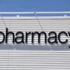 Sign displaying the word pharmacy against a white background
