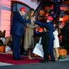US President Donald Trump high-fives a boy as he and First Lady Melania Trump host a Halloween event at the White House in Washington, DC, on OCtober 30, 2025. (Photo by Jim WATSON / AFP) (Photo by JIM WATSON/AFP via Getty Images)