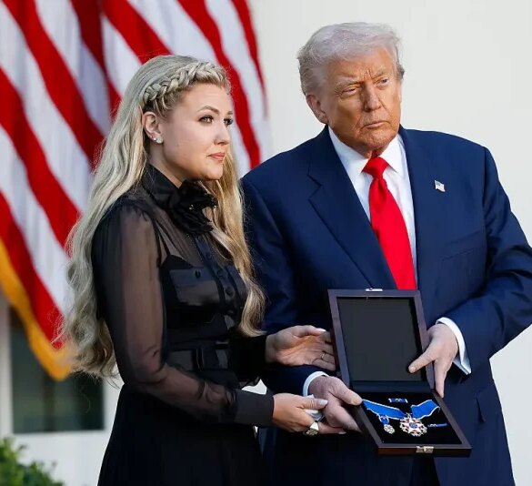 WASHINGTON, DC - OCTOBER 14: U.S. President Donald Trump posthumously awards the Presidential Medal of Freedom to late conservative activist Charlie Kirk as he presents the Medal to his wife Erika Kirk (L) during a ceremony in the Rose Garden of the White House on October 14, 2025 in Washington, DC. Today marks the National Day of Remembrance for Charlie Kirk who was shot and killed on September 10th at Utah Valley University. (Photo by Kevin Dietsch/Getty Images)