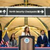 ARLINGTON, VA - JULY 8: U.S. Secretary of Homeland Security Kristi Noem, flanked by Deputy Administrator of the Transportation Security Administration Ha McNeil and Adam Stahl, TSA Senior Official Performing the Duties of the Administrator, speaks during a news conference at Ronald Reagan Washington National Airport on July 8, 2025 in Arlington, Virginia. For the first time in nearly two decades, the TSA is easing its shoe removal rule introduced five years after a 2001 shoe-bombing attempt by allowing some travelers to keep their shoes on at security checkpoints. (Photo by Kent Nishimura/Getty Images)