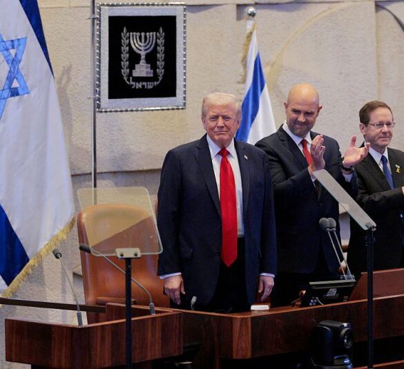 JERUSALEM - OCTOBER 13: U.S. President Donald Trump arrives to address the Knesset, Israel’s parliament, with Amir Ohana, Speaker of the Israeli Knesset, and Israeli President Isaac Herzog on October 13, 2025 in Jerusalem. President Trump is visiting the country hours after Hamas released some of the remaining Israeli hostages captured on Oct. 7, 2023, part of a US-brokered ceasefire deal to end the war in the Gaza Strip. (Photo by Chip Somodevilla/Getty Images)