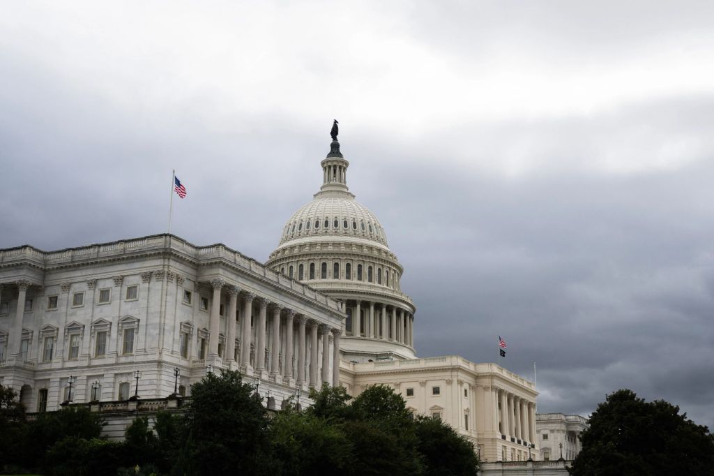 An image collage containing 1 images, Image 1 shows The US Capitol building under a cloudy sky