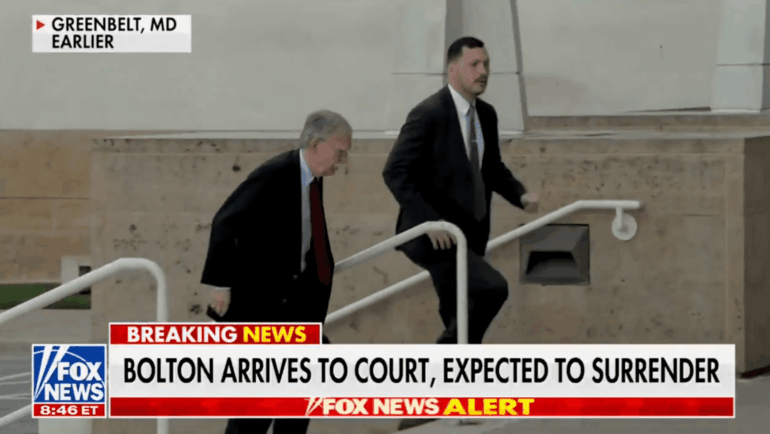 Politics: john bolton surrenders to authorities