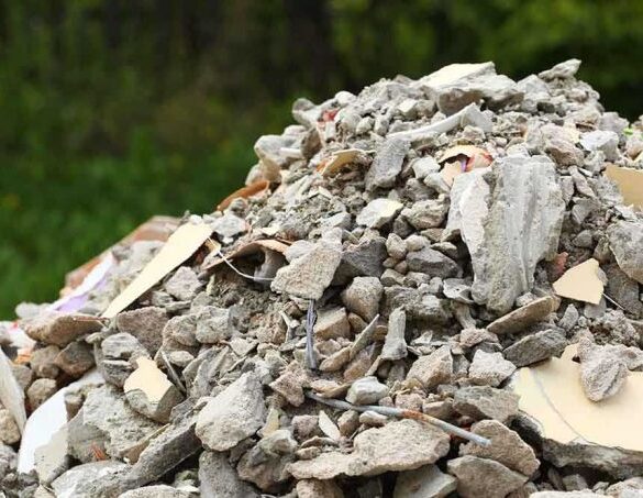 A large pile of construction debris consisting of broken concrete and other materials