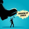 A man holding a megaphone under a large boot, symbolizing censorship of free speech