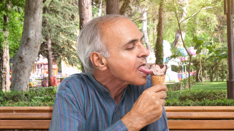 Satire news: grown man licking ice cream cone placed on