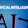 FILE PHOTO: Illustration shows AI (Artificial Intelligence) letters and robot miniature