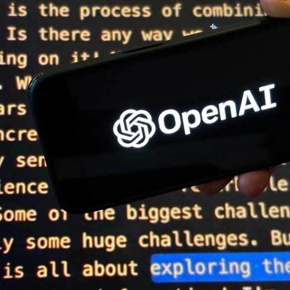 A hand holds a phone displaying the OpenAI logo over a screen showing text.
