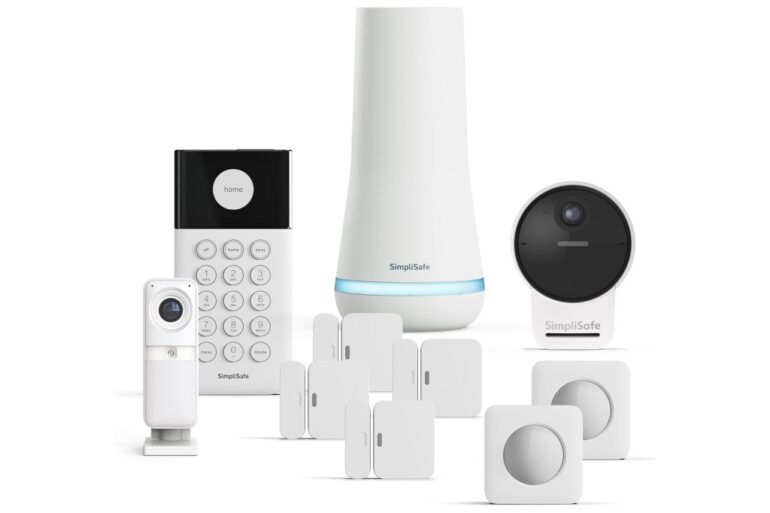 A collection of SimpliSafe smart home security system components, including a keypad, base station, indoor camera, outdoor camera, entry sensors, and motion sensors.