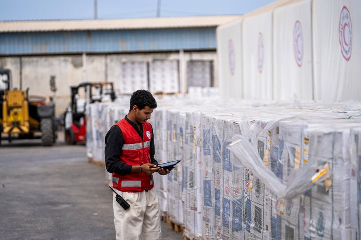 A member of the Egyptian Red Crescent takes stock at the aid warehouse in Al-Arish, near the Rafah crossing between Egypt and Gaza, on Oct. 9, 2025.