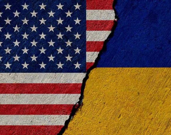 Torn United States and Ukraine flags.