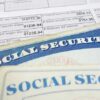 Social security cards on top of tax documents