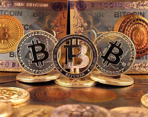 Bitcoins and Bitcoin-themed banknotes in various designs.