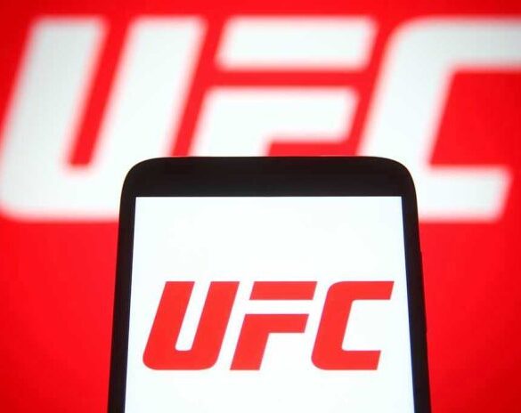 UFC logo on phone screen and background.