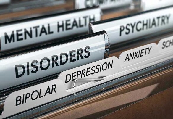 File folders labeled with mental health disorders and psychiatry.
