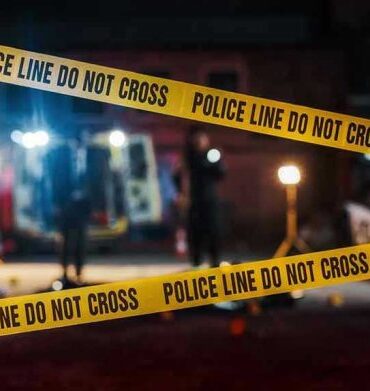 Yellow police tape in front of crime scene.