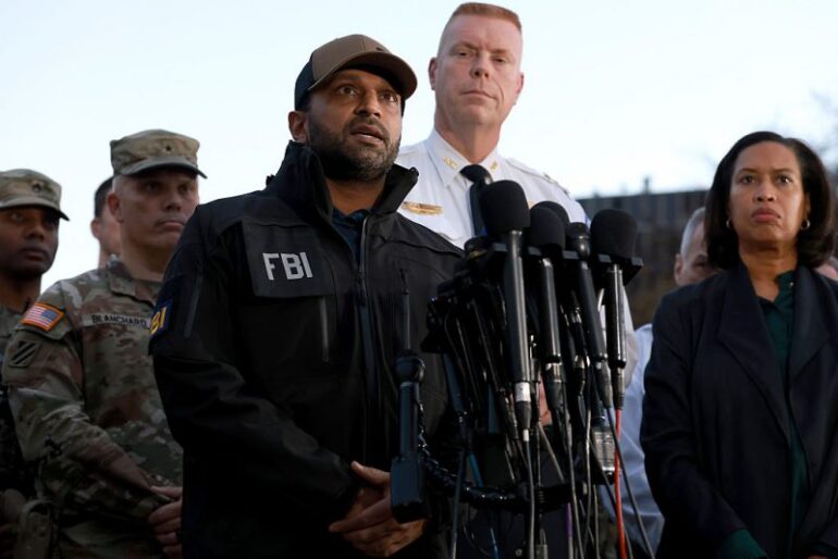 WASHINGTON, DC - NOVEMBER 26: (L-R) FBI Director Kash Patel, Executive Assistant Chief of the Washington Metropolitan Police Department Jeffery Carroll and Washington, DC Mayor Muriel Bowser speak to the media following the shooting of two National Guard soldiers near the White House on November 26, 2025 in Washington, DC. Two members of the West Virginia National Guard were shot near the White House Wednesday afternoon in what authorities are calling a targeted shooting. (Photo by Anna Moneymaker/Getty Images)