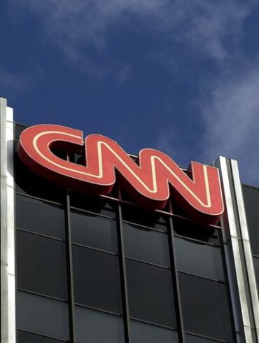 384757 02: The Cable News Network (CNN) logo adorns the top of CNN's offices on the Sunset Strip, January 24, 2000 in Hollywood, CA. CNN was hit with job cuts earlier this week after CNN's parent company, Time-Warner, Inc., completed its merger with America Online, Inc. (Photo by David McNew/Newsmakers)