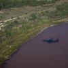 This photograph shows an aerial view of a shadow of a plane flying over the pink Lavalduc Lake in Istres, southeastern France, on October 4, 2024. (Photo by CLEMENT MAHOUDEAU / AFP) (Photo by CLEMENT MAHOUDEAU/AFP via Getty Images)