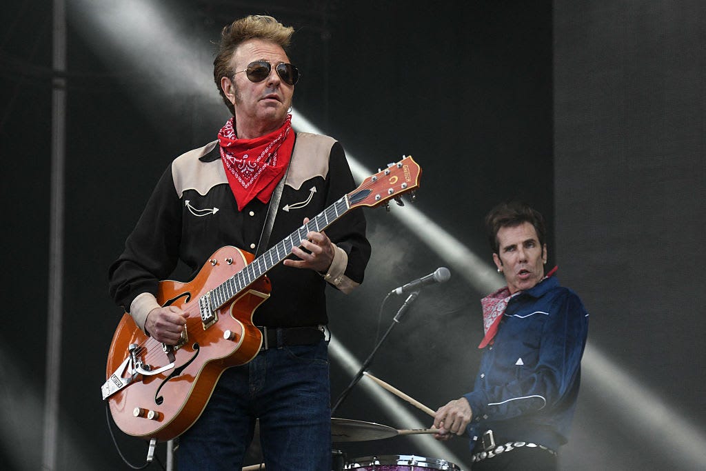 Brian Setzer (L) and Slim Jim Phantom, of the Stray Cats, perform on stage during the 31st Eurockeennes rock music festival in Belfort, eastern France, on July 7, 2019.