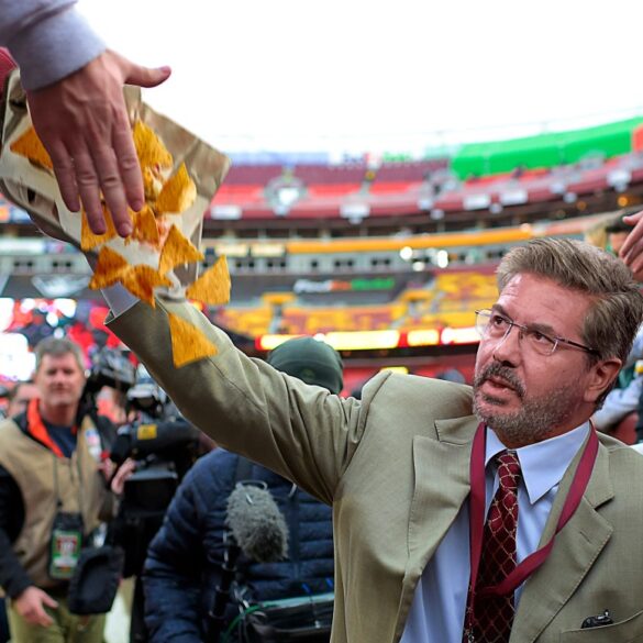 Satire news: dan snyder walking around commanders stadium knocking food