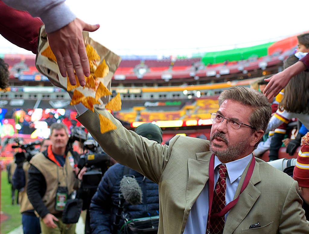 Satire news: dan snyder walking around commanders stadium knocking food