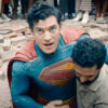 Superman being helped up by a pedestrian in 2025's Superman movie