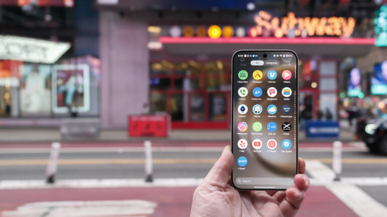 OnePlus 15 in Times Square New York City on the busy street showing the cameras and sides of the phone in addition to home screen panels and Settings menus