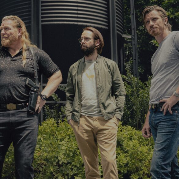 Bodhi and Bigfoot stand looking in the distance in Tulsa King season 3