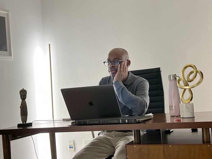 The author in front of a laptop.