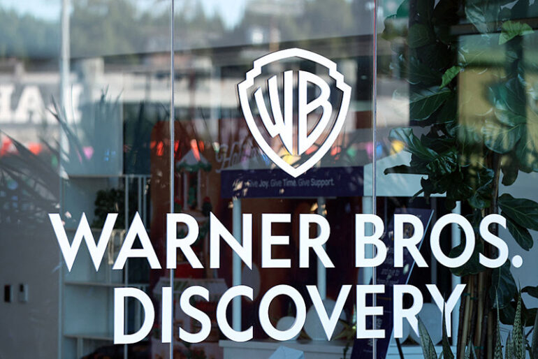 The logo of Warner Bros. Discovery is seen at one of their offices in Culver City, California, on December 5, 2025. (Photo by Patrick T. Fallon / AFP via Getty Images)