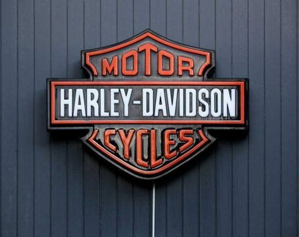 Harley-Davidson Motor Cycles logo on dark wall.