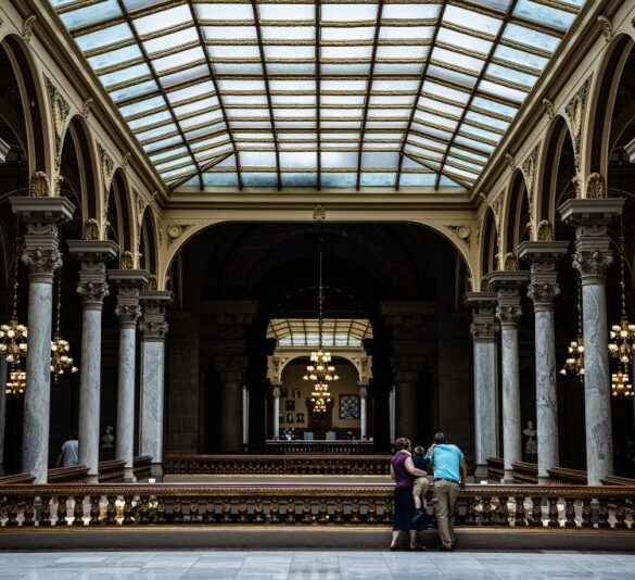 INDIANAPOLIS, IN - JULY 25: A family watches protesters from the top floor of the Indiana State Capitol building on July 25, 2022 in Indianapolis, Indiana. Activists are gathering during a special session of the Indiana state Senate concerning abortion access in the state. (Photo by Jon Cherry/Getty Images)