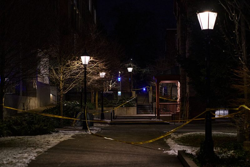 Police crime scene tape is seen near the Barus & Holley engineering building at Brown University, the site of a December 13 mass shooting in Providence, Rhode Island, on December 15, 2025. A gunman remained at large after a weekend mass shooting at elite Brown University left two dead and nine wounded, with US authorities releasing new footage of a masked "person of interest" captured on surveillance cameras. The shooting took place December 13 in a building where exams were underway on the Ivy League campus in Providence, Rhode Island when a man with a rifle burst in and opened fire before fleeing. (Photo by Bing Guan / AFP via Getty Images)
