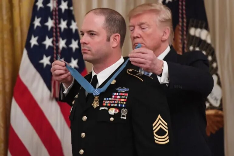 US President Donald Trump presents the Medal of Honor to US Army Master Sergeant Matthew Williams for actions in 2008 in Afghanistan, during a ceremony in the East Room of the White House in Washington, DC, October 30, 2019. (Photo by SAUL LOEB / AFP) (Photo by SAUL LOEB/AFP via Getty Images)