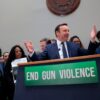 Senator Chris Murphy speaking at a news conference with survivors and families of gun violence, advocating for gun control legislation.