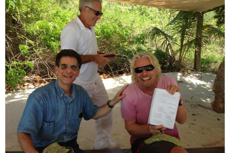 Richard Branson, Jeffrey Epstein, and another man under a canopy.
