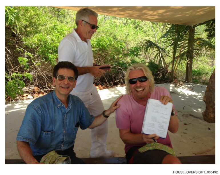 Richard Branson, Jeffrey Epstein, and another man under a canopy.