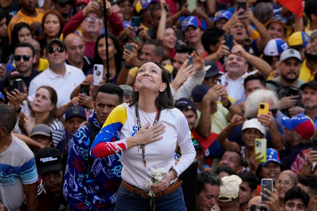 Venezuelan opposition leader Maria Corina Machado addresses supporters at a protest.