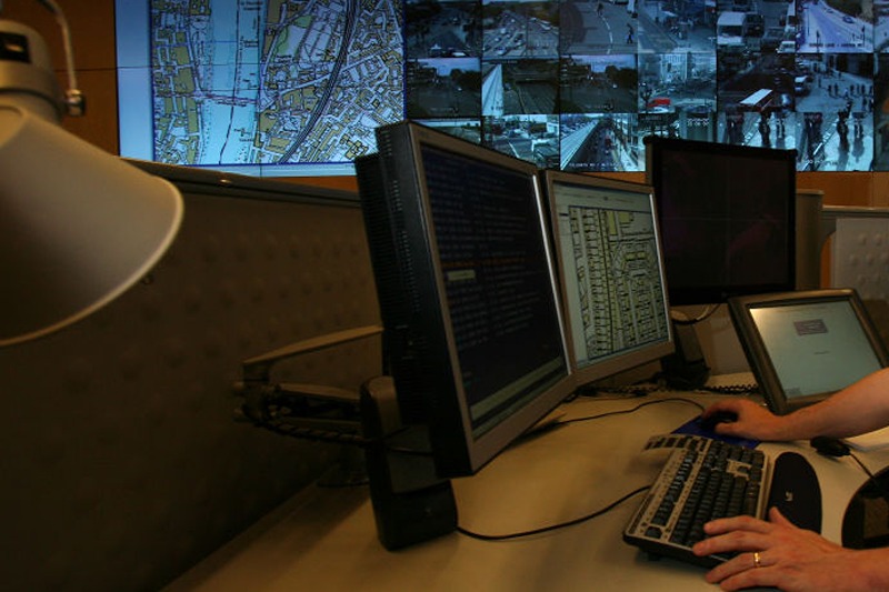 LONDON - APRIL 20: A police officer watches banks of television monitors showing a fraction of London's CCTV camera network in the Metropolitan Police's new Special Operations Room on April 20, 2007 in London, England. The new high tech operations room, believed to be the largest of its kind, is set to be the focal point for the policing of any large event or operation in London and is designed to handle public order events and major incidents, the Special Operations Room will kick off with the policing of this Sunday's London Marathon. (Photo by Matt Cardy/Getty Images)