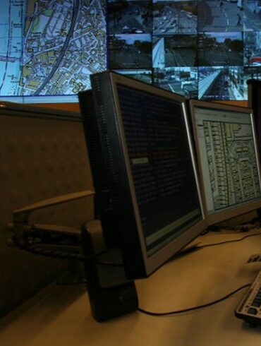 LONDON - APRIL 20: A police officer watches banks of television monitors showing a fraction of London's CCTV camera network in the Metropolitan Police's new Special Operations Room on April 20, 2007 in London, England. The new high tech operations room, believed to be the largest of its kind, is set to be the focal point for the policing of any large event or operation in London and is designed to handle public order events and major incidents, the Special Operations Room will kick off with the policing of this Sunday's London Marathon. (Photo by Matt Cardy/Getty Images)