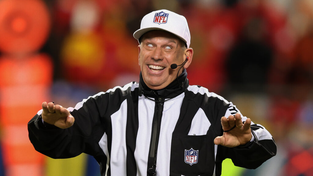 Satire news: cackling referee declares penalty for pass interference shall