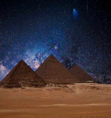 Egyptian pyramids under a night sky. Several researchers believe astronomical alignments at this site point to signs of an ancient advanced civilization.