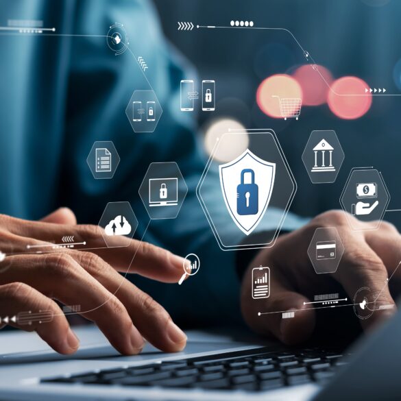 Hands on a laptop with overlaid logos representing network security