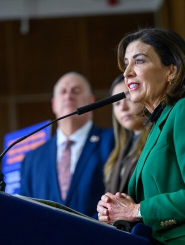 Governor Kathy Hochul speaking at a podium during the SPARC Kips Bay groundbreaking.