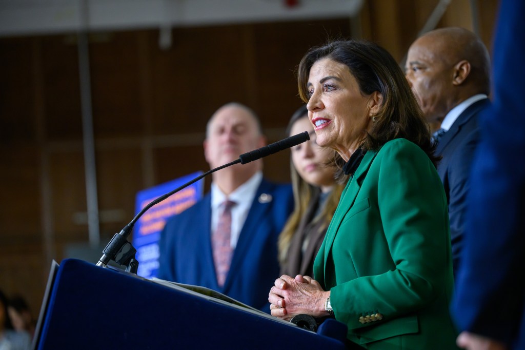 Governor Kathy Hochul speaking at a podium during the SPARC Kips Bay groundbreaking.