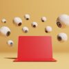 Conceptual image with a bunch of floating eyeballs in different sizes overlooking a red computer, could symbolize ideas around malware and computer viruses